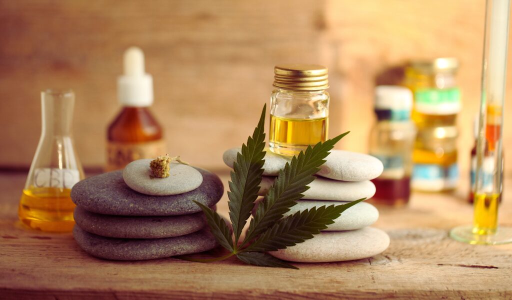 CBD Strains Canada CBD flower and oil products on a wooden table